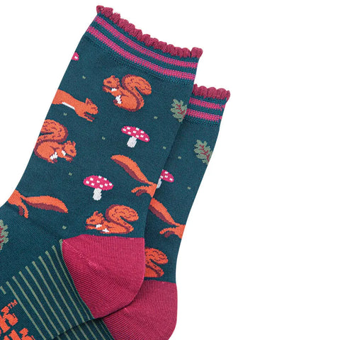 Pair of socks with squirrel and mushroom pattern on a white background
